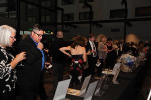 Guests bidding at the silent auction