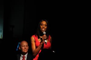 Sonia Marie Trimble speaks under a spotlight